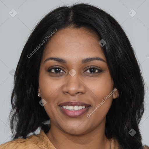 Joyful black young-adult female with long  black hair and brown eyes