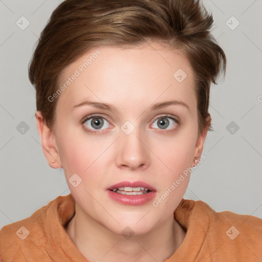 Joyful white young-adult female with short  brown hair and blue eyes