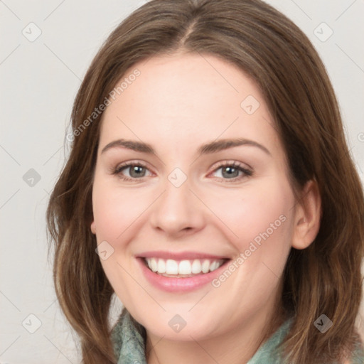 Joyful white young-adult female with medium  brown hair and green eyes