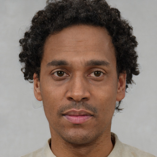 Neutral black adult male with short  brown hair and brown eyes
