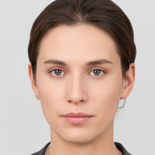 Neutral white young-adult female with short  brown hair and brown eyes