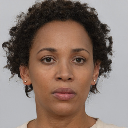 Neutral black adult female with short  brown hair and brown eyes