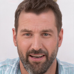 Joyful white adult male with short  brown hair and brown eyes