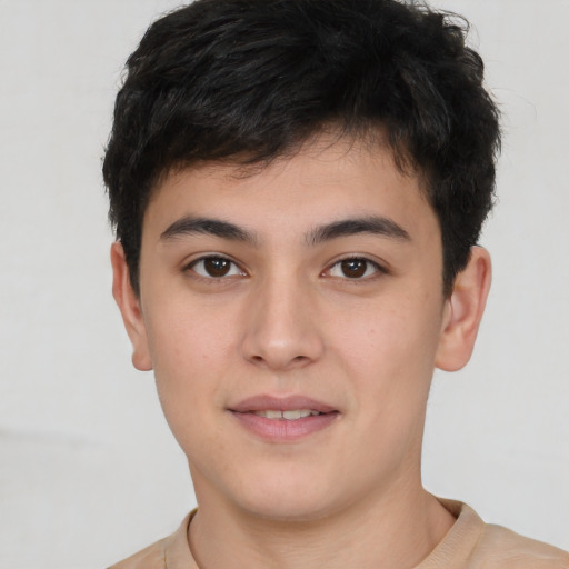 Joyful white young-adult male with short  black hair and brown eyes