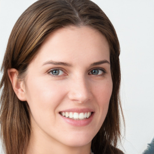 Joyful white young-adult female with long  brown hair and blue eyes