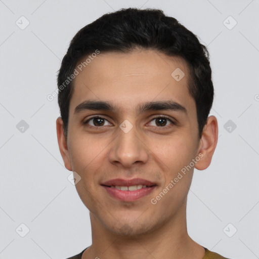 Joyful white young-adult male with short  black hair and brown eyes