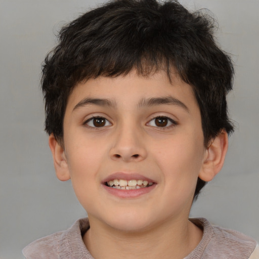 Joyful white child male with short  brown hair and brown eyes