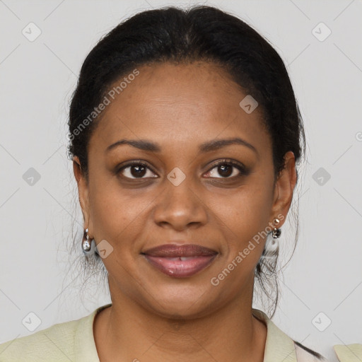 Joyful black young-adult female with long  brown hair and brown eyes