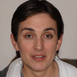 Joyful white young-adult female with medium  brown hair and blue eyes