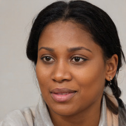 Joyful black young-adult female with medium  brown hair and brown eyes