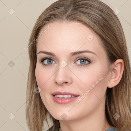 Joyful white young-adult female with long  brown hair and blue eyes