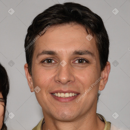 Joyful white adult male with short  brown hair and brown eyes