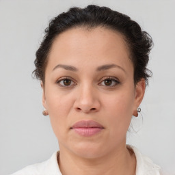 Joyful white adult female with short  brown hair and brown eyes