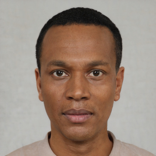 Neutral black young-adult male with short  black hair and brown eyes