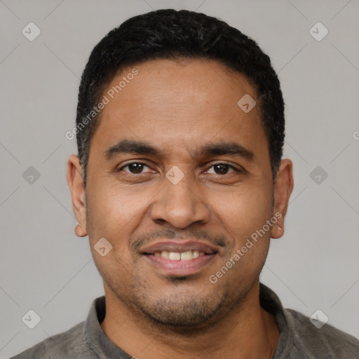 Joyful latino young-adult male with short  black hair and brown eyes