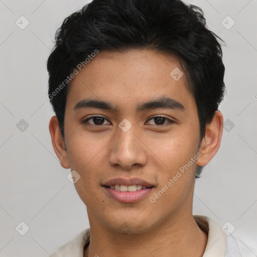 Joyful asian young-adult male with short  black hair and brown eyes