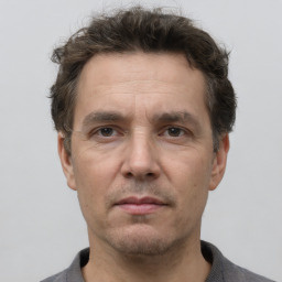 Neutral white adult male with short  brown hair and brown eyes