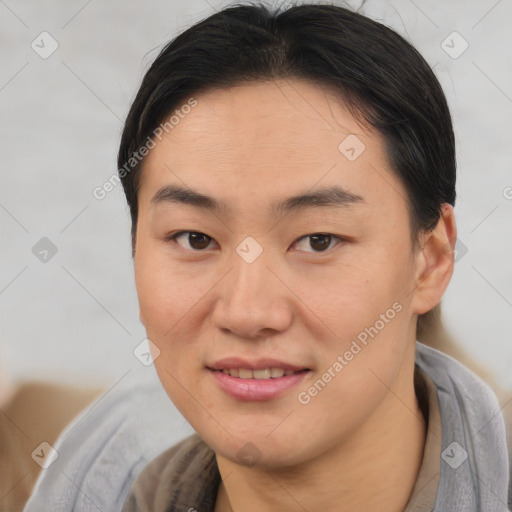 Joyful asian young-adult female with short  brown hair and brown eyes