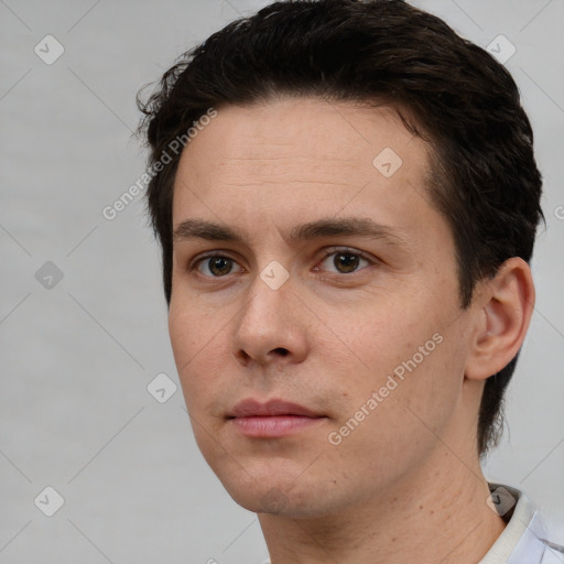 Neutral white young-adult male with short  brown hair and brown eyes