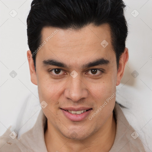 Joyful latino young-adult male with short  brown hair and brown eyes