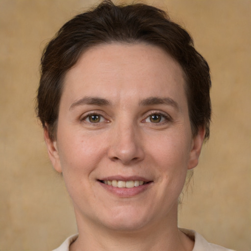 Joyful white adult female with short  brown hair and brown eyes