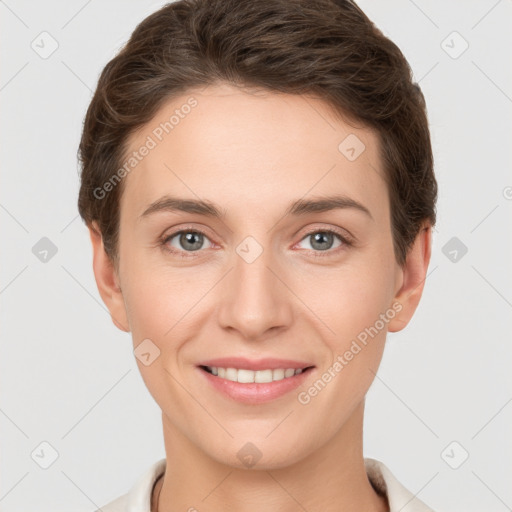 Joyful white young-adult female with short  brown hair and grey eyes