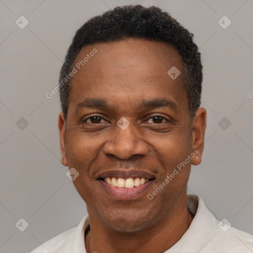 Joyful latino adult male with short  black hair and brown eyes