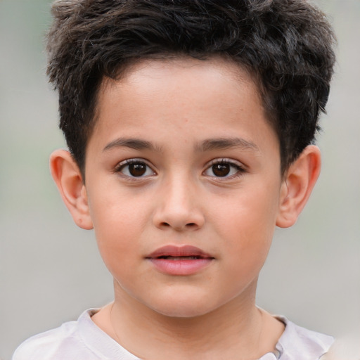 Joyful white child male with short  brown hair and brown eyes
