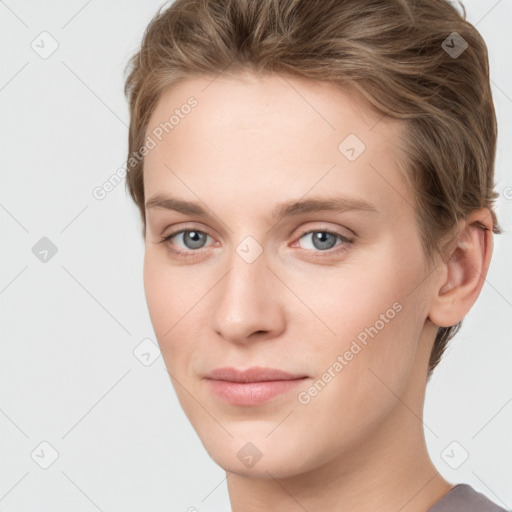 Joyful white young-adult female with short  brown hair and grey eyes