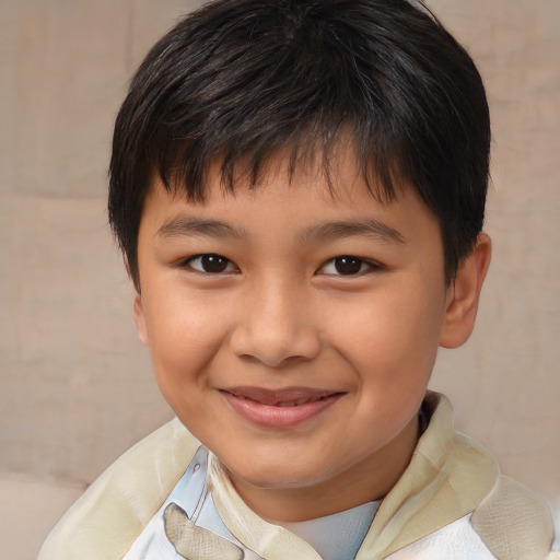 Joyful asian child male with medium  brown hair and brown eyes