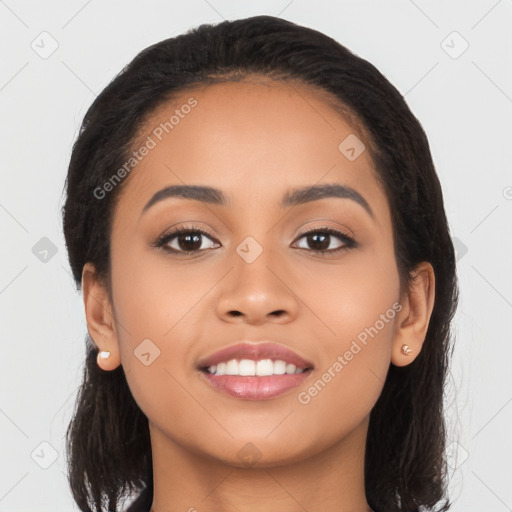 Joyful latino young-adult female with long  black hair and brown eyes