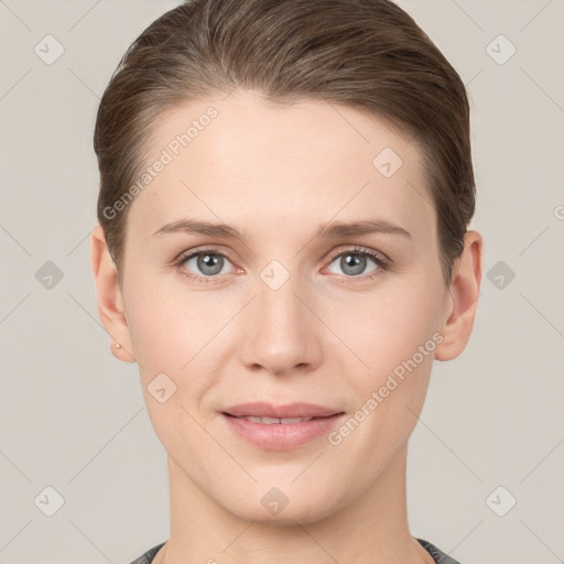 Joyful white young-adult female with short  brown hair and grey eyes