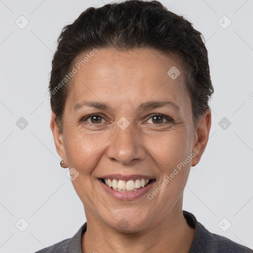 Joyful white adult female with short  brown hair and brown eyes