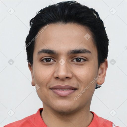 Joyful latino young-adult male with short  black hair and brown eyes