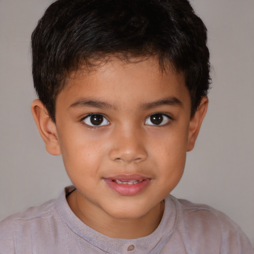 Joyful latino child male with short  brown hair and brown eyes