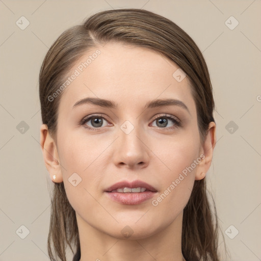 Joyful white young-adult female with long  brown hair and grey eyes