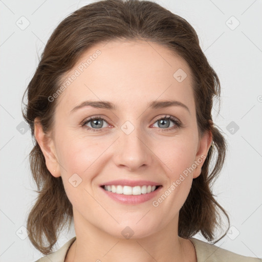 Joyful white young-adult female with medium  brown hair and green eyes