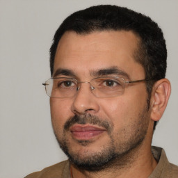 Neutral white adult male with short  black hair and brown eyes