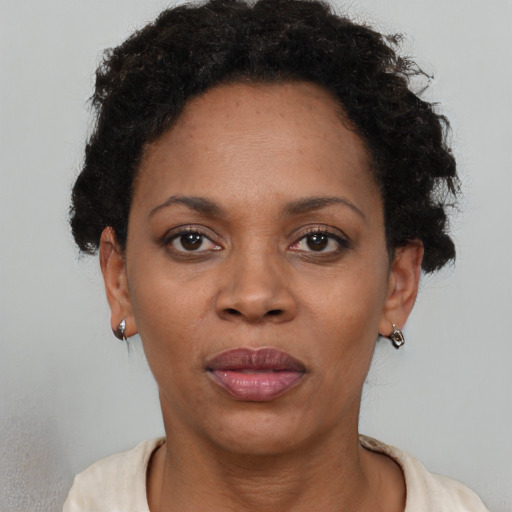 Neutral black adult female with short  black hair and brown eyes