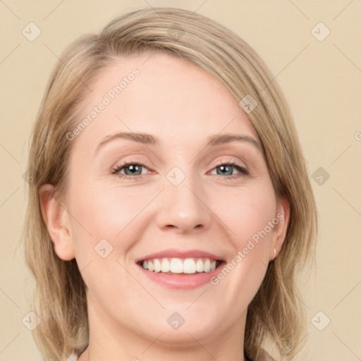 Joyful white young-adult female with medium  brown hair and blue eyes