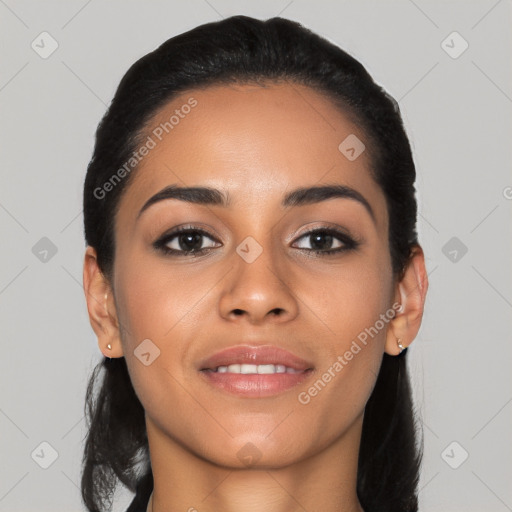 Joyful latino young-adult female with short  black hair and brown eyes