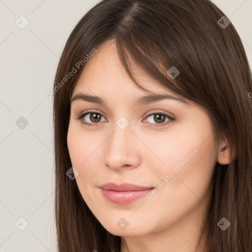 Neutral white young-adult female with long  brown hair and brown eyes