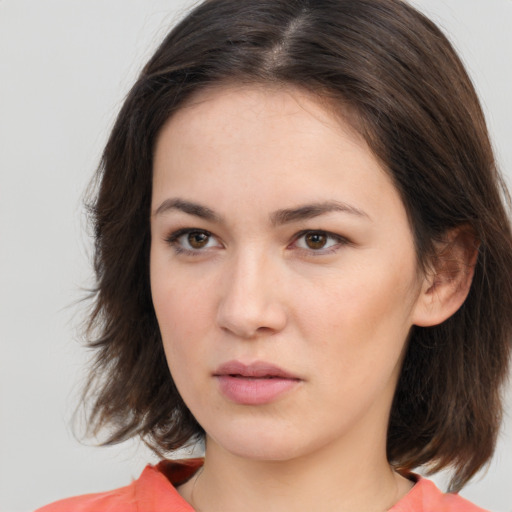 Neutral white young-adult female with medium  brown hair and brown eyes