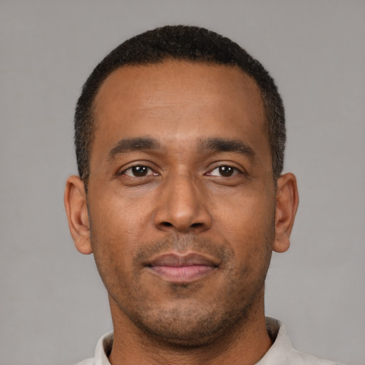 Neutral latino young-adult male with short  brown hair and brown eyes