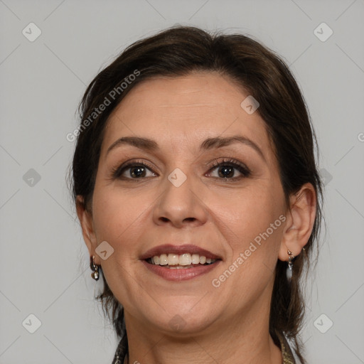 Joyful white adult female with medium  brown hair and brown eyes