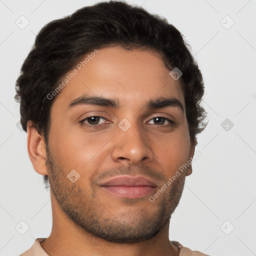 Joyful latino young-adult male with short  brown hair and brown eyes