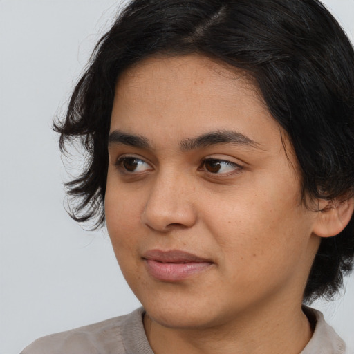 Joyful white young-adult female with medium  black hair and brown eyes