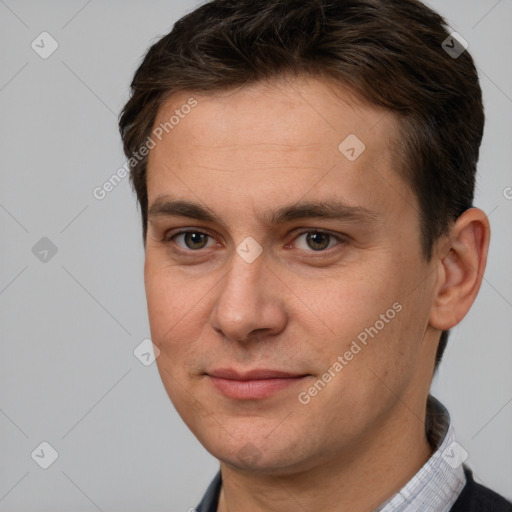 Joyful white adult male with short  brown hair and brown eyes