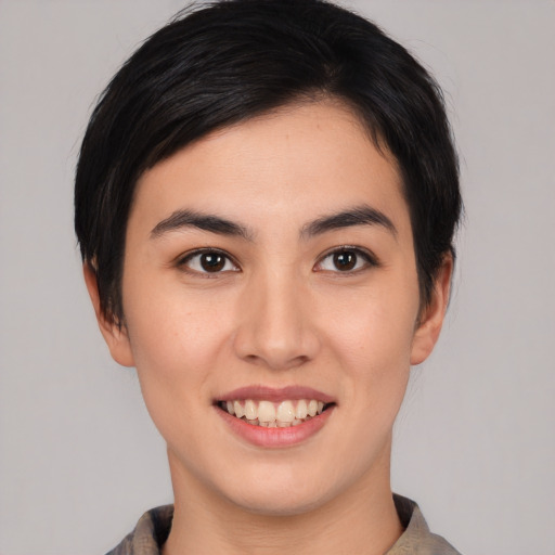 Joyful white young-adult female with medium  black hair and brown eyes