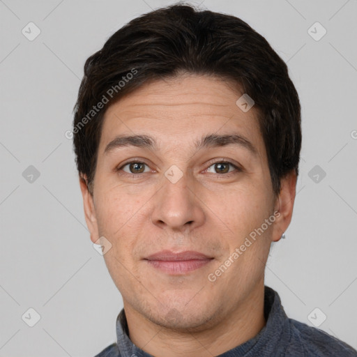 Joyful white adult male with short  brown hair and brown eyes